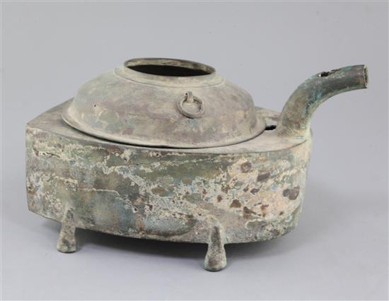 A Chinese archaic bronze steamer vessel, in two parts, Xian, Han dynasty, 206 B.C.-220 A.D., 30cm long, holes